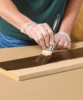 Applying Rich Dark Walnut Gel Stain Water Based Finish on a wood plank for a smooth, no drip surface.
