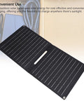Foldable 24W Solar Panel Charger With 5V USB Output for camping and hiking, fully extended showing monocrystalline silicon panels