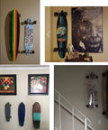 Four Pack Adjustable Skateboard Wall Mount Racks with Hardware Holds Four Boards Vertically for Dope Wall Display and Organization No Board Included Great for Garage Studio or Shop Organization with skateboards displayed in a home interior.