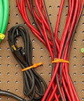 Heavy Duty Reusable Cable Ties With No Sweat Quick Release Lever Rock Solid Wire Control 275 Pound Pull Strength used on organized cables.