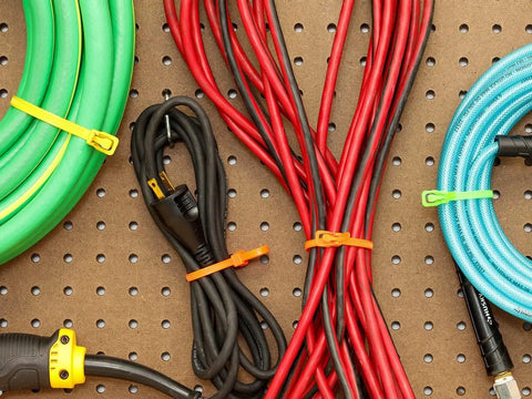 Heavy Duty Reusable Cable Ties With No Sweat Quick Release Lever Rock Solid Wire Control 275 Pound Pull Strength used on organized cables.