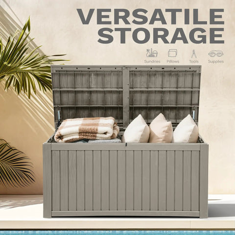 Beefy 220 Gallon Outdoor Deck Storage Box with Removable Divider open showing pillows and blankets inside on patio