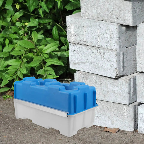 Plastic mold for creating hollow bricks next to stacked concrete blocks, featuring Hollow Brick Molds For Concrete Reusable Plastic Paver Mold For DIY Garden Walls And Patio Decor Rugged Concrete Forms For Outdoor Pathways And Landscaping.