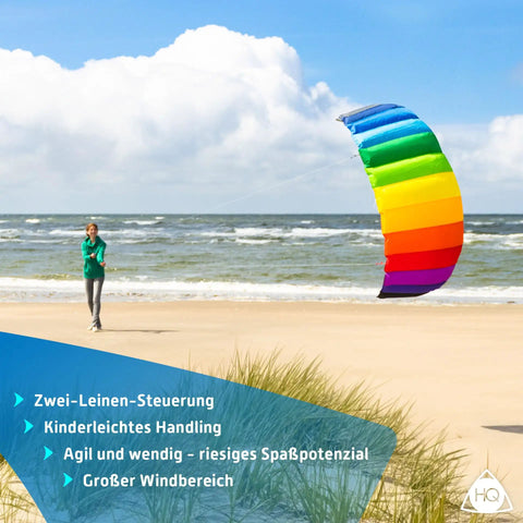 Symphony Beach III 2.5 Stunt Kite Rainbow Dual Line Foil Sport Kite For Beginners And Pros soaring above a beach