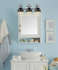 Duncan Bath Fixture 3602-BA3 CH-BLK With Chrome Finish And Matte Black Shades above white vanity in modern bathroom setting