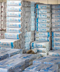 R-30 Kraft Faced Fiberglass Batt Insulation Fits 2x10 Floor Or Attic 8 Bundle stacked in warehouse for renovation projects.