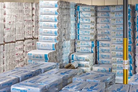 R-30 Kraft Faced Fiberglass Batt Insulation Fits 2x10 Floor Or Attic 8 Bundle stacked in warehouse for renovation projects.