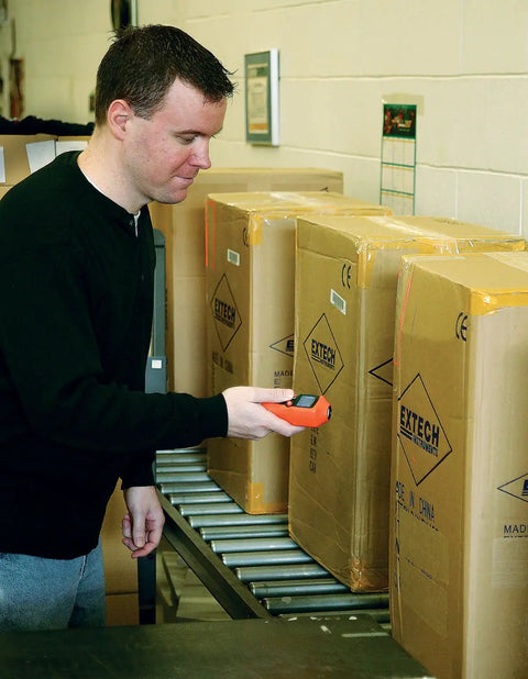 Person using Mini Laser Photo Tachometer RPM Counter With No Contact Measurement Reads 2 To 99999 RPM on packages.