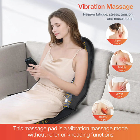 Woman using Back Massager Chair Pad With Heat, 10 Vibrating Motors for Office Chair and Home Use, on a sofa, viewing phone.