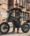 Teen with Villain 4160W Electric Dirt Bike With 52V 26Ah Battery, 14 And 12 Inch Fat Tires, urban neighborhood background.