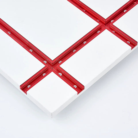 Close-up of Universal 48 Inch T Track with easy install predrilled mounting holes and wood screws, anodized red finish on white board.
