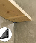 Heavy Duty Angle Corner Brackets, Black Steel Fasteners For Desk, Bed, And Furniture Edge Joints, 10-Piece Set supporting a wooden shelf