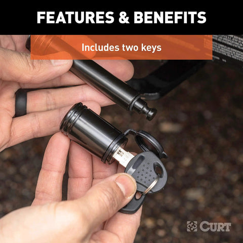 Locking Trailer Hitch Pin With Five Eighth Inch Diameter For Two Inch Receiver in hand showing barbell lock with keys