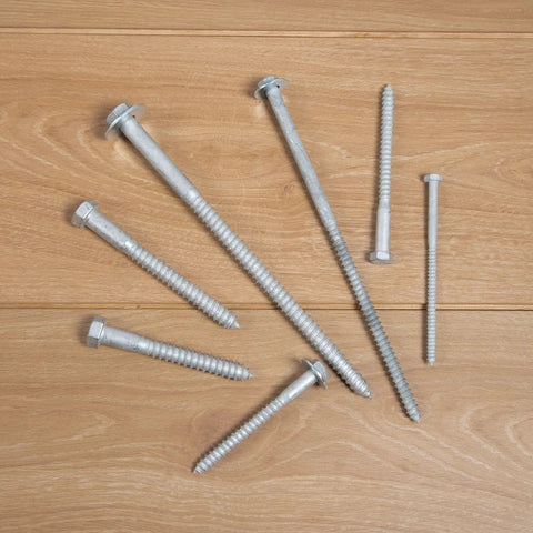 Wood Lag Bolts For Outdoor DIY Projects Quarter Inch By Three Inch 100 Count With Flat Washers laid out on wooden surface
