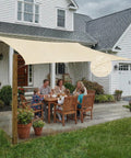 Family dining under Built Tough Waterproof Shade Sail In Custom Sizes 12 By 16 Feet Rectangle For Patio Backyard And Pergola 220 GSM Sun Shade With 95 Percent UV Block And PU Coated Polyester.