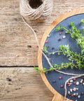 Unbleached 12 Ply Cotton Butcher Twine 720 Feet Food Grade String for cooking herbs with knife on slate and wood board