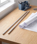 Industrial Aluminum Rod 2 Pcs Round Metal Bar Stock for Machining and Fabrication Shaft Rod Material on wooden desk with blueprints