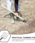 Person using Beast Of A Handheld Manure Fork For Farm And Garden Use With Five Solid Tines on dirt.