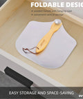 OVTHMT pizza peel top view: aluminum 12x14 inch paddle with foldable wooden handle and leather hanging cord