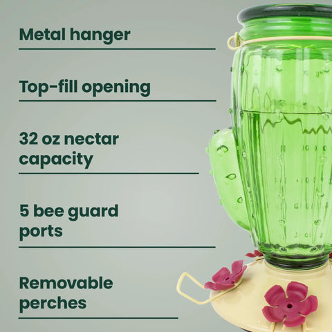 Green Cactus Top Fill Glass Hummingbird Feeder with metal hanger, 32 oz capacity, bee guards, and removable perches, partial side view