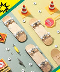 Eight Piece Fingerboard Bearing Wheels And Tool Kit White Wheels With Alloy Racks And Screwdrivers Plus Nut Drivers For 34mm Wide Decks Finger Skateboard Trucks shown with traffic-themed props.