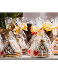 Heckin Great Cellophane Treat Bags 7 X 14 Inches With Gold Twist Ties 100 Pack Sturdy Opp Material Perfect For Cookies Candy Snacks Chocolate Marshmallow Wrapping containing gingerbread houses.