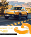 Two Pack Tow Hook Covers For Rivian R1T And R1S, Silicone Protective Caps in yellow, displayed in front of a Rivian truck