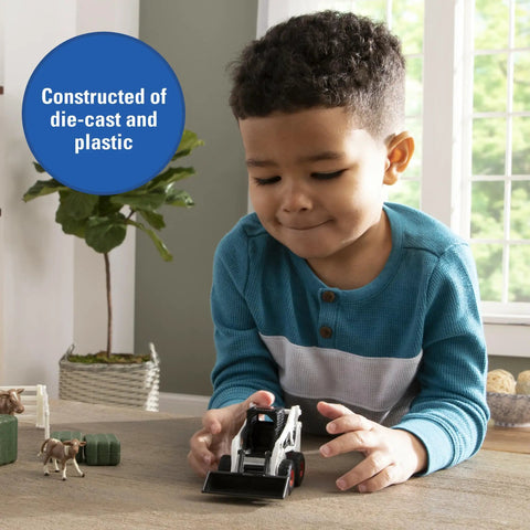 Child playing with Skid Steer Farm Toy Playset 1 To 32 Scale Die Cast Metal Construction With Realistic Bobcat Look Includes Farm Animals Fencing Hay Bales For Kids Ages 3 And Up on table.