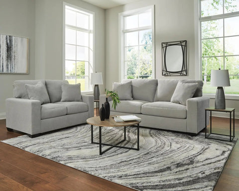 Living room with Shavontae Modern Table Lamps Set Of 2 27.5 Inch Gray Resin Bases With White Fabric Drum Shades on side tables.