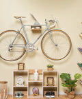 Wall Mounted Bike Rack With Bamboo Shelf For Indoor Storage And Decor displaying minimalist bicycle hanger in living room setup