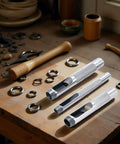 Three Piece Grommet Hole Punch Set With Steel Hollow Punches For Leatherworking And Crafts Includes Quarter Inch Three Eighths Inch And Half Inch Sizes Heavy Duty Steel Construction For Long Lasting Durability And Precision For Do It Yourself Projects on a workbench.