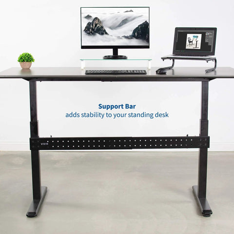 Rock Solid Universal Steel Desk Stabilizer Bar Clamp On That Stops Side To Side Wobble For Sit To Stand Desks Expands From 36 To 61.6 Inches Keeps Your Workspace Sturdy And Steady With Smooth Width Adjustment installed on a standing desk