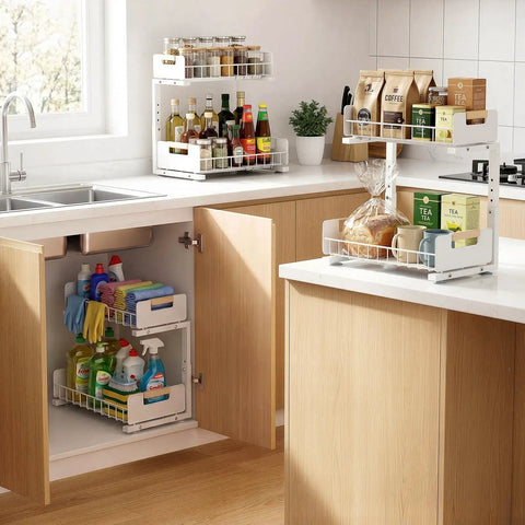 Sleek Two Tier Pull Out Under Sink Organizer For Kitchen Cabinets with cleaning supplies under sink and pantry items on counter.