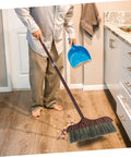 Person using Long Handle Heavy Duty Broom With Soft Beveled Bristles For No Sweat Dust Removal on hardwood floor.