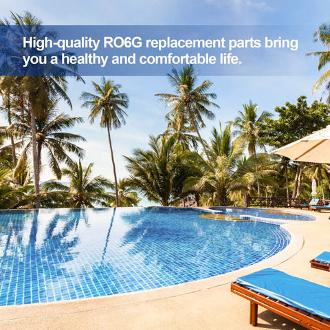 Outdoor pool with clear water and palm trees, featuring lounge chairs under umbrellas by the poolside.