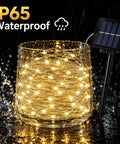 Outdoor Solar String Lights With 100 LEDs 33 Feet 8 Modes Weatherproof Fairy Lights glowing in water showing IP65 waterproof feature.