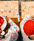 Children in holiday hats crafting with Dope Mini Hot Glue Gun Kit With 30 Glue Sticks, Fast Heating Hot Melt Gun for DIY arts and projects