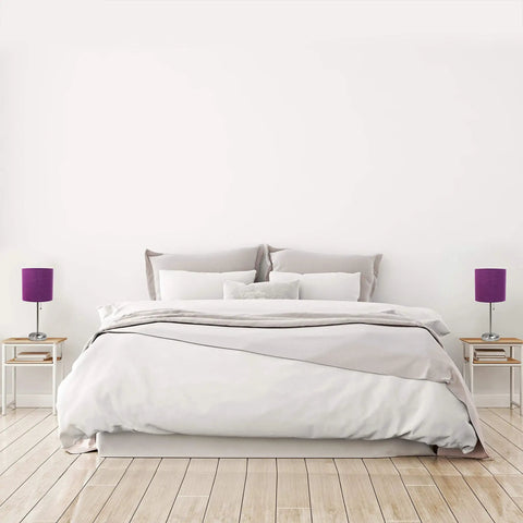 Brushed Steel Stick Table Lamp Set with Charging Outlet and Purple Fabric Shades Two Pack on bedside tables in a modern bedroom.