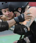 Roller derby players wearing Slide On Derby Wrist Guards For Roller Derby, Unrestricted Finger Motion, Cupped Palm And Wrist Protection