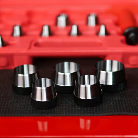 Close-up view of Pro Grade Hollow Punch Kit For Leather And Gasket Making, 13-in-1 hole punch set with multiple metal punches.