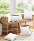 20x20 Inch Outdoor Pillow Inserts Set of 2 Waterproof Cushions on a wicker bench, indoor patio setup