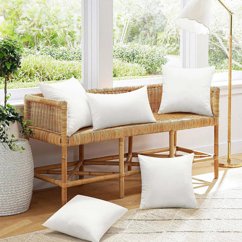 20x20 Inch Outdoor Pillow Inserts Set of 2 Waterproof Cushions on a wicker bench, indoor patio setup