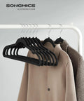 Velvet Non Slip Closet Hangers Pack of 50 With Shoulder Notches for Delicate Straps, black hangers displaying beige and brown clothing.