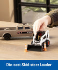 Child playing with One Thirty Two Scale Die Cast Skid Steer And Pickup Truck Construction Toy Set With Trailer And Cones Plus Worker Figure