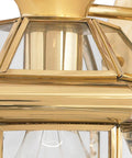 Close-up of Newbury Outdoor Wall Lantern 12 Inch 1 Light Polished Brass Sconce With Clear Beveled Glass French Country Exterior Light