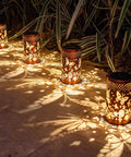 Outdoor Solar Lanterns Hanging Light With Butterfly Pattern Waterproof Led Garden Decor shining on patio at night