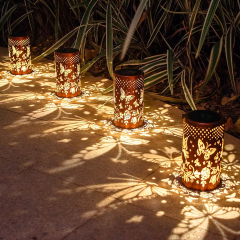 Outdoor Solar Lanterns Hanging Light With Butterfly Pattern Waterproof Led Garden Decor shining on patio at night