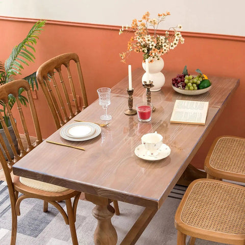 Clear Table Protector Mat 14 By 24 Inches, 1.5mm Thick Heavy Duty Desk Cover on a wooden dining table, protecting surface.