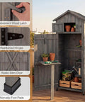 Outdoor Wooden Storage Shed With Tall Vertical Tool Cabinet Folding Table And Removable Shelves For Your Patio Deck Backyard And Lawn Grey Finish 30x20x70 Inches featuring wood latch, hinges, barn door, and foot pads.