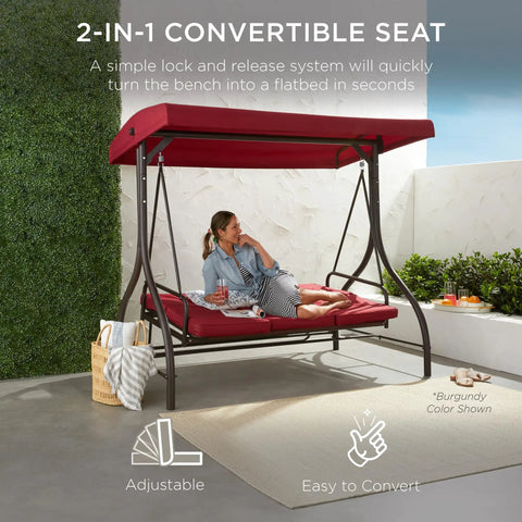 Three Seat Outdoor Canopy Swing Glider with Convertible Flatbed Patio Hammock in burgundy on a patio